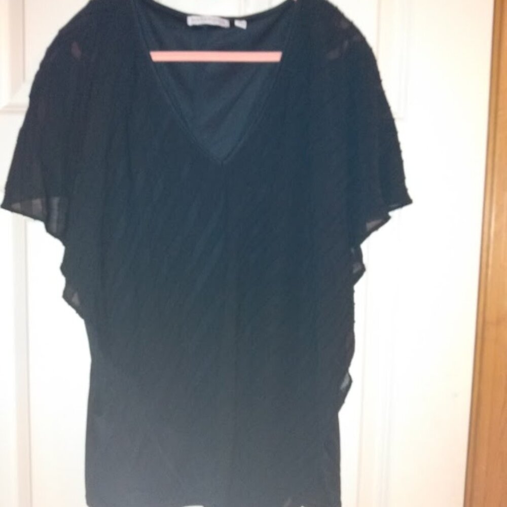 Notations: Womans black V neck lined blouse. Size XL.